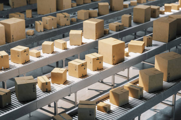 Cardboard boxes on conveyor belt in a distribution warehouse. Cardboard boxes on conveyor belt in a distribution warehouse.